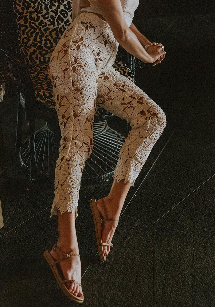 Model in lace crochet pants