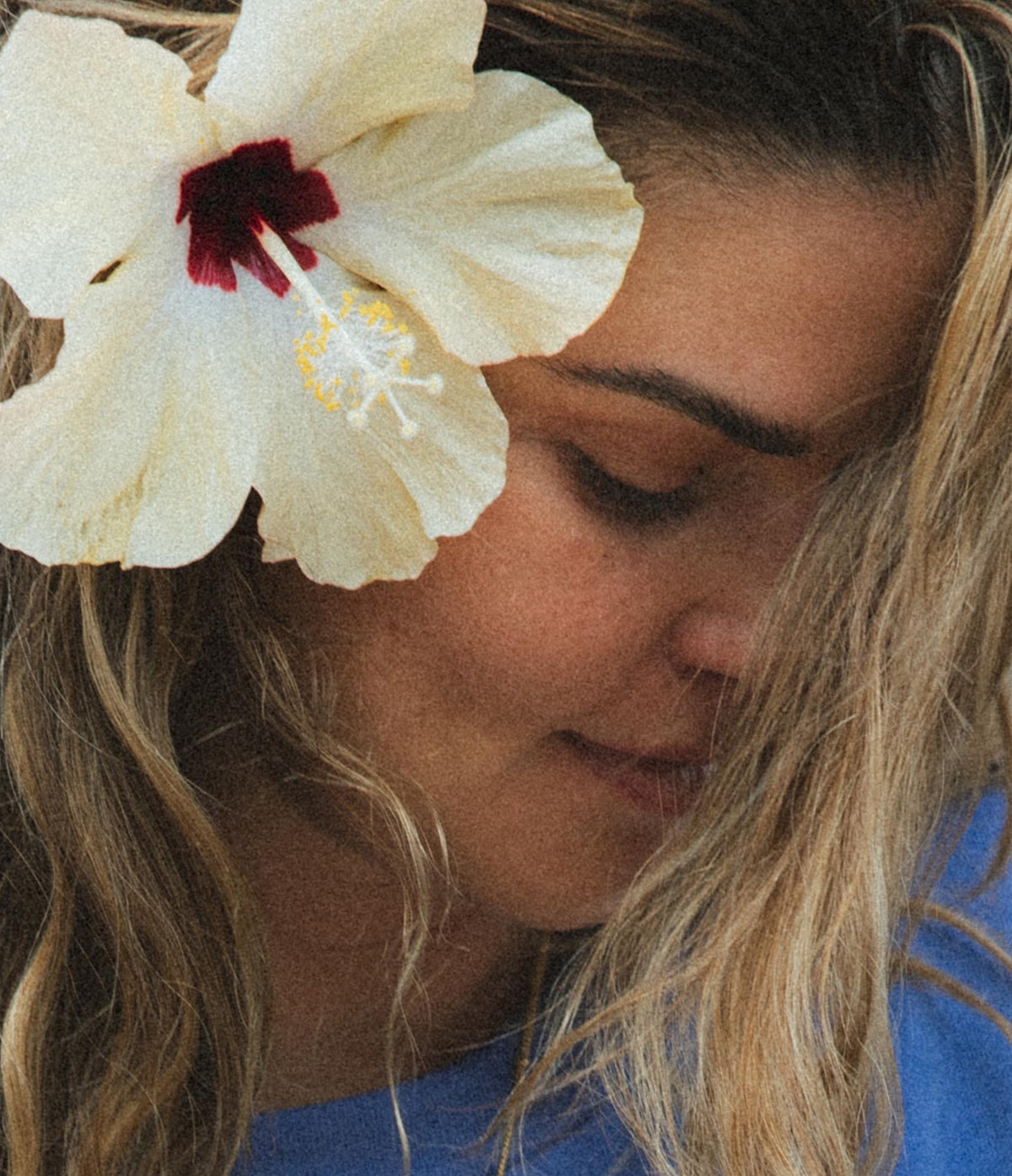 Model with a hibiscus behind her ear
