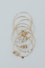 wings hawaii ti leaf bangles triple puka shell thumbnail