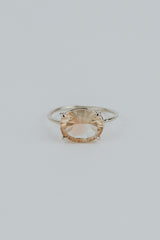 Wings Hawaii Halo ring – Sunstone in solid 14K white gold. Fine jewelry handcrafted in Maui. Oval-cut gemstone, single prong-set on delicate band. Made in Hawaii gifts.
