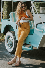 Model wearing Wings Hawaii retro pocket pants in marigold corduroy thumbnail