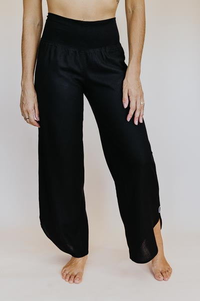 Wings Hawaii best-selling women's Pau Hana pants in classic black. Soft, stretchy waistband and scalloped hem. Small batch, sustainable clothing designed in Maui, sewn in Bali. 