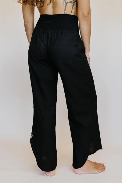 Wings Hawaii best-selling women's Pau Hana pants in classic black. Soft, stretchy waistband and scalloped hem. Small batch, sustainable clothing designed in Maui, sewn in Bali. 