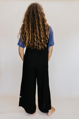 Wings Hawaii model wearing Sun Pocket Overalls in Black thumbnail