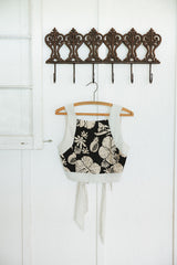 Wings Hawaii pinafore crop top in Hana Nightfall. Black and tan aloha print clothing handmade in Maui.  thumbnail