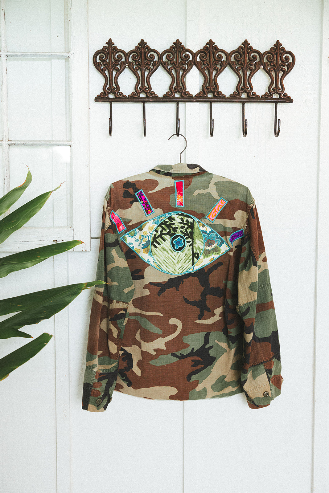 Wings Hawaii Evil Eye vintage army camouflage jacket. Upcycled and handcrafted with vintage aloha fabrics. Handmade in Maui. 