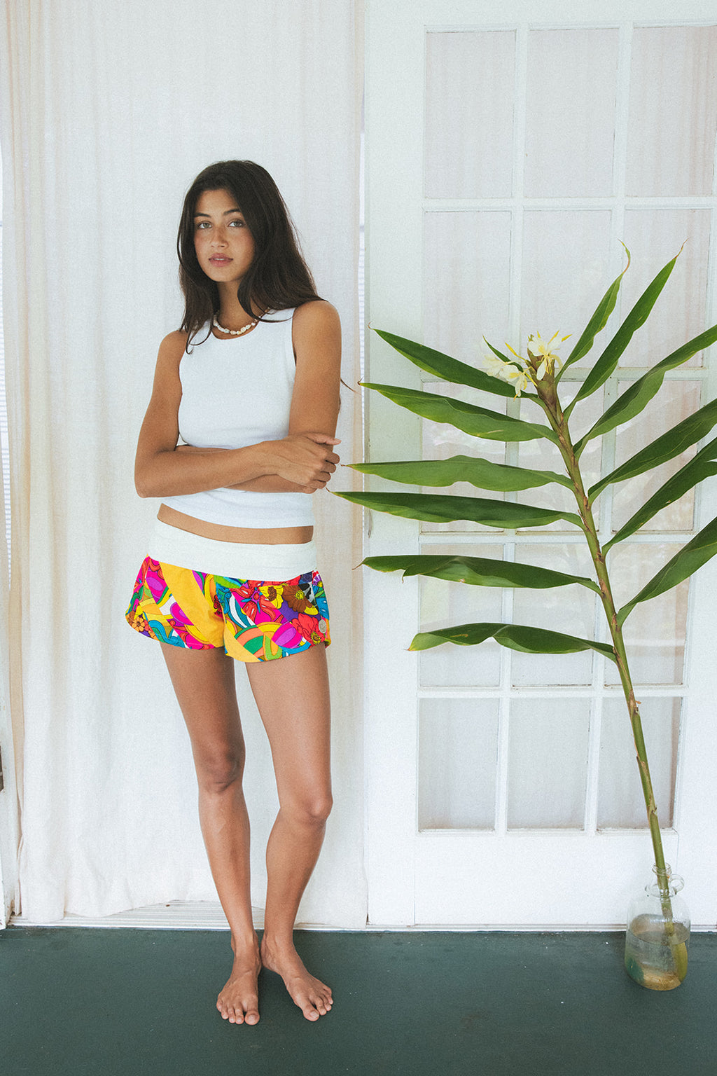 Wings Hawaii Patchwork Pau Hana Shorts in Tropic Rush. Handmade, one of a kind, upcycled vintage quilt fabric. Stretchy cotton waistband and back pocket. Made with aloha in Maui. Sustainable, small batch, slow fashion. 