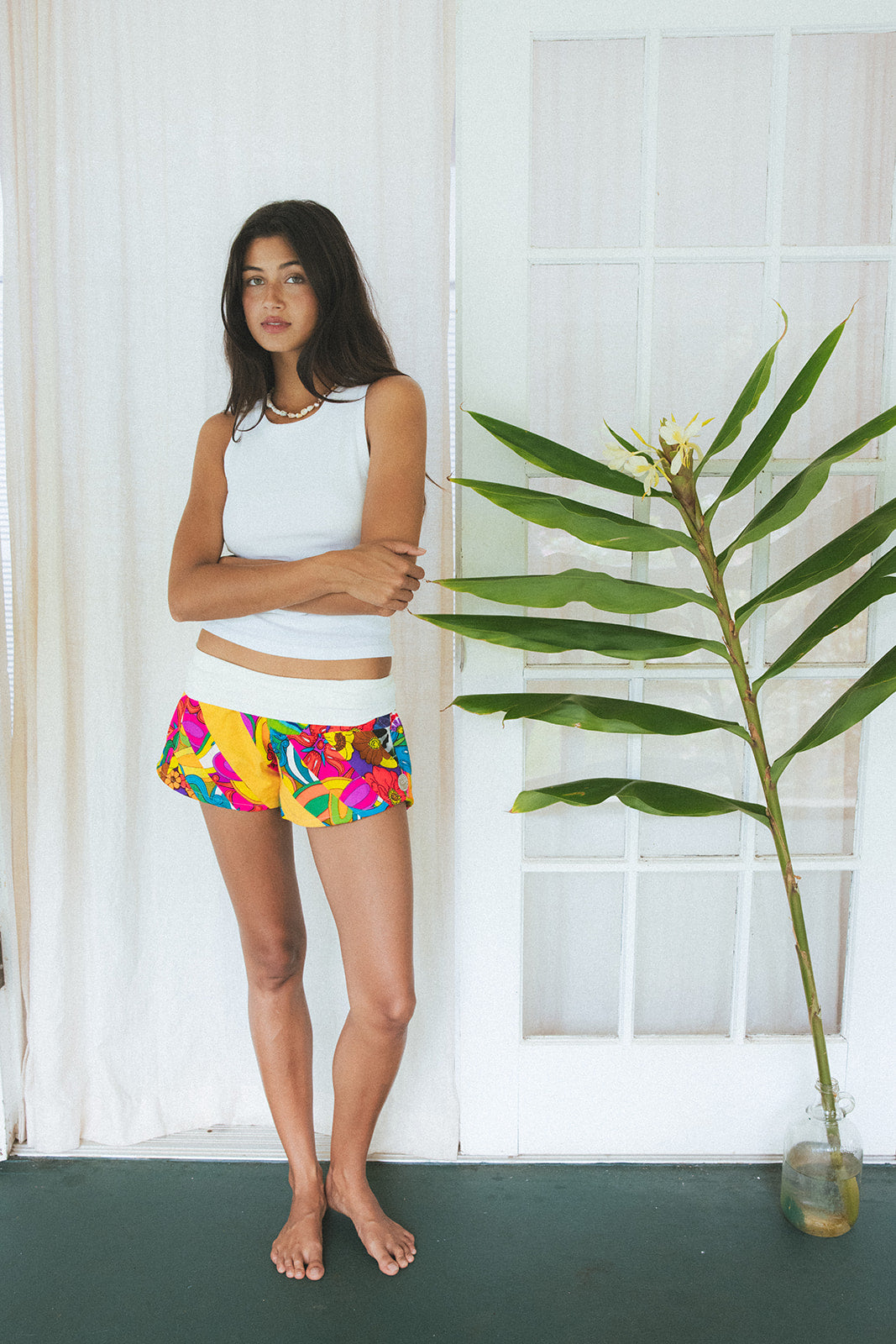 Wings Hawaii Patchwork Pau Hana Shorts in Tropic Rush. Handmade, one of a kind, upcycled vintage quilt fabric. Stretchy cotton waistband and back pocket. Made with aloha in Maui. Sustainable, small batch, slow fashion. 