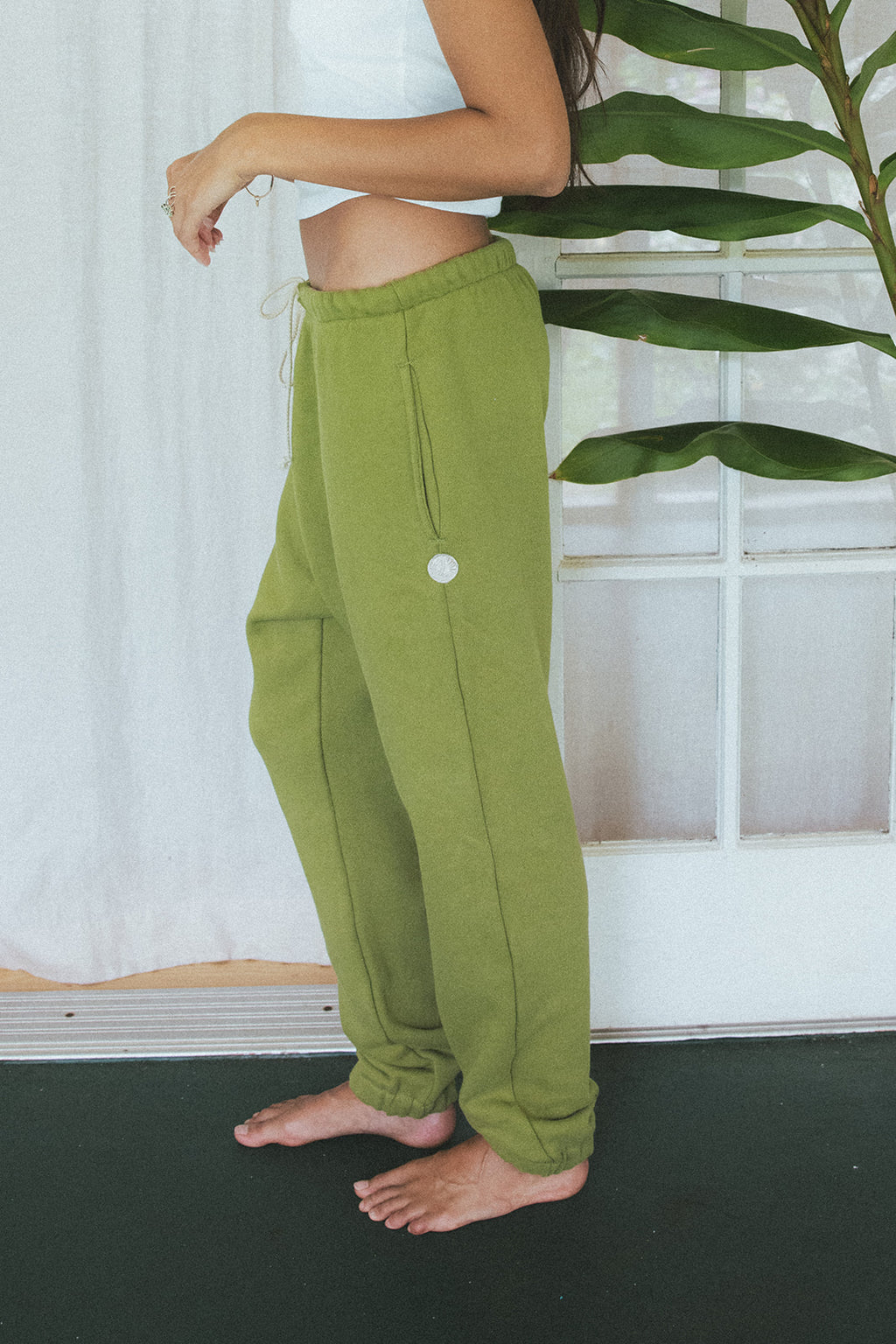 Wings Hawaii Green Joggers in 100% cotton. Designed in Maui, made in Los Angeles, USA. Small batch, sustainable, beach-inspired, elevated essentials. 