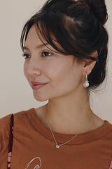 model wearing wings hawaii prong set sunstone necklace in 14k white gold  thumbnail