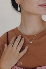 model wearing wings hawaii prong set sunstone necklace in 14k white gold  thumbnail