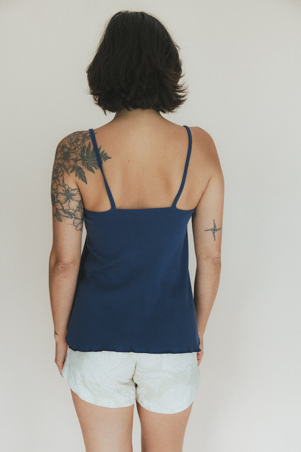 Wings Hawaii baby rib tank top in navy blue. Spaghetti straps and flowy, flattering shape. 100% cotton, designed in Maui. 