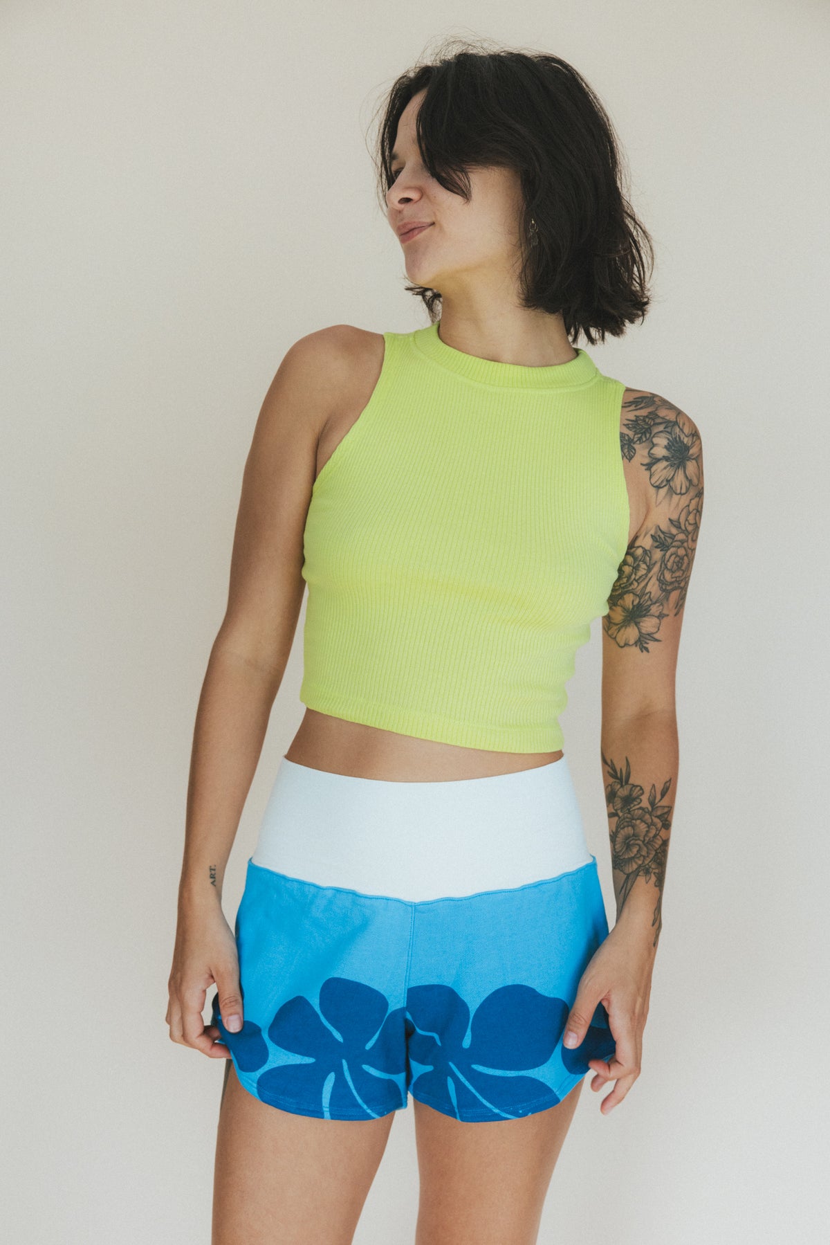 Wings Hawaii Ribbed Lexi Tank Top. Stretchy high neck cropped muscle tank top in Lime green. Designed in Maui, sewn in Bali. Sustainable, small batch, boho beachy chic women's apparel. 