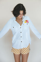 Wings Hawaii sun + moon linen blouse in white. Long sleeve shirt with side pockets. Handmade and upcycled with vintage aloha fabrics. Handcrafted in Maui with aloha. Small batch, sustainable, high quality women's apparel made in Hawaii.  thumbnail