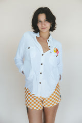 Wings Hawaii sun + moon linen blouse in white. Long sleeve shirt with side pockets. Handmade and upcycled with vintage aloha fabrics. Handcrafted in Maui with aloha. Small batch, sustainable, high quality women's apparel made in Hawaii.  thumbnail