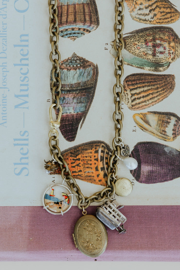 Wings Hawaii charm necklace with steamboat charm and locket