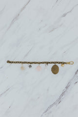 Wings Hawaii Vintage Charm Bracelet. Brass chain with mix of vintage charms, pink opal, pearls, and a locket. Fine jewelry handcrafted in Maui.  thumbnail