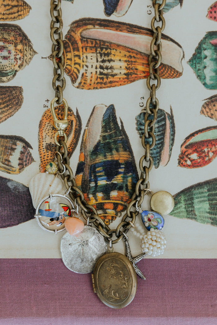  Wings Hawaii brass chain charm necklace with sand dollar, starfish, and shell charms and locket
