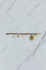 Wings Hawaii Vintage Charm Bracelet. Brass chain with mix of vintage charms, pink opal, pearls, and a locket. Fine jewelry handcrafted in Maui.  thumbnail
