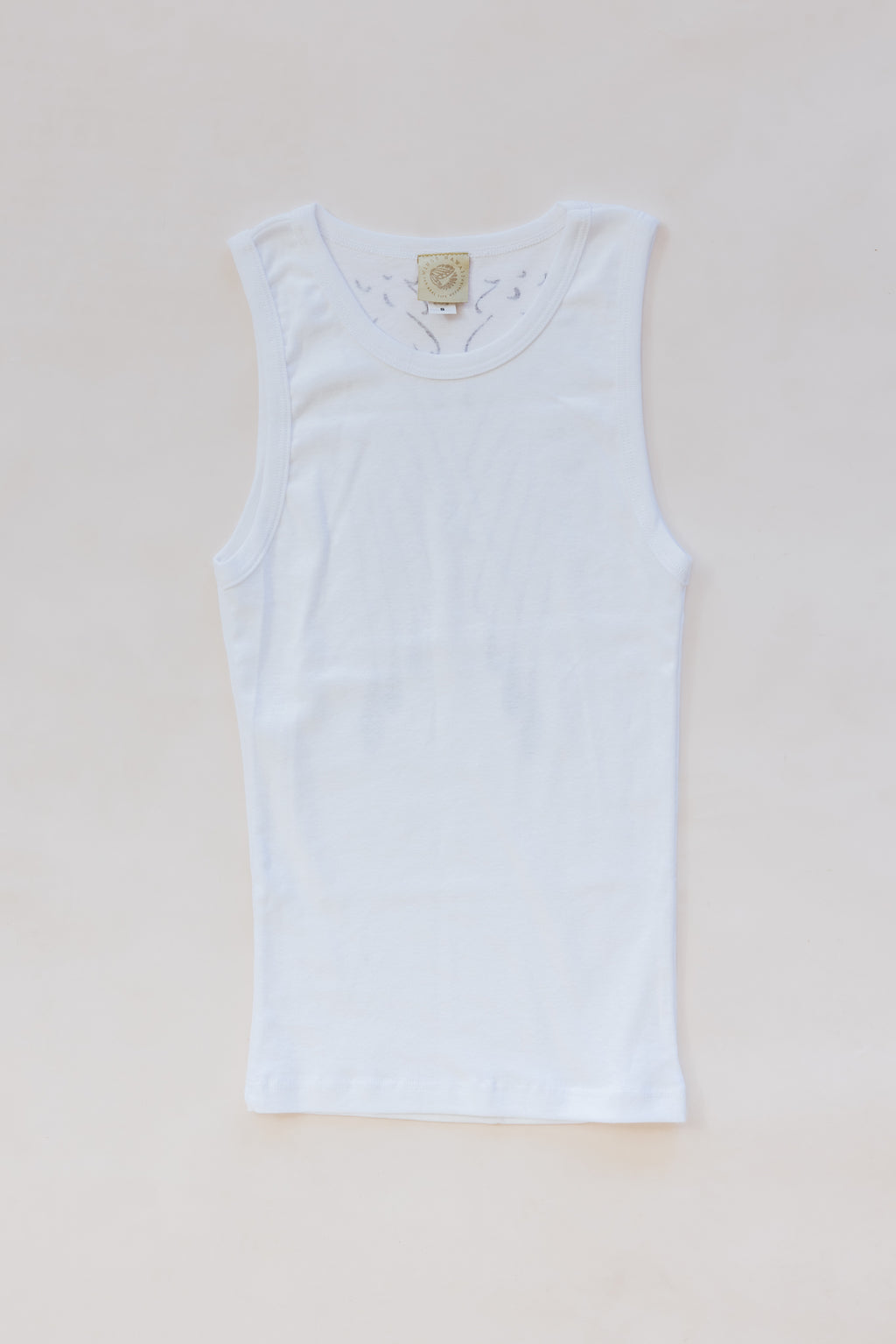 Wings Hawaii White Wing Tank. Angel wings in black print on white cotton tank top. Screenprinted by hand in Haiku, Maui. Original, sustainable, slow fashion made in Hawaii. 