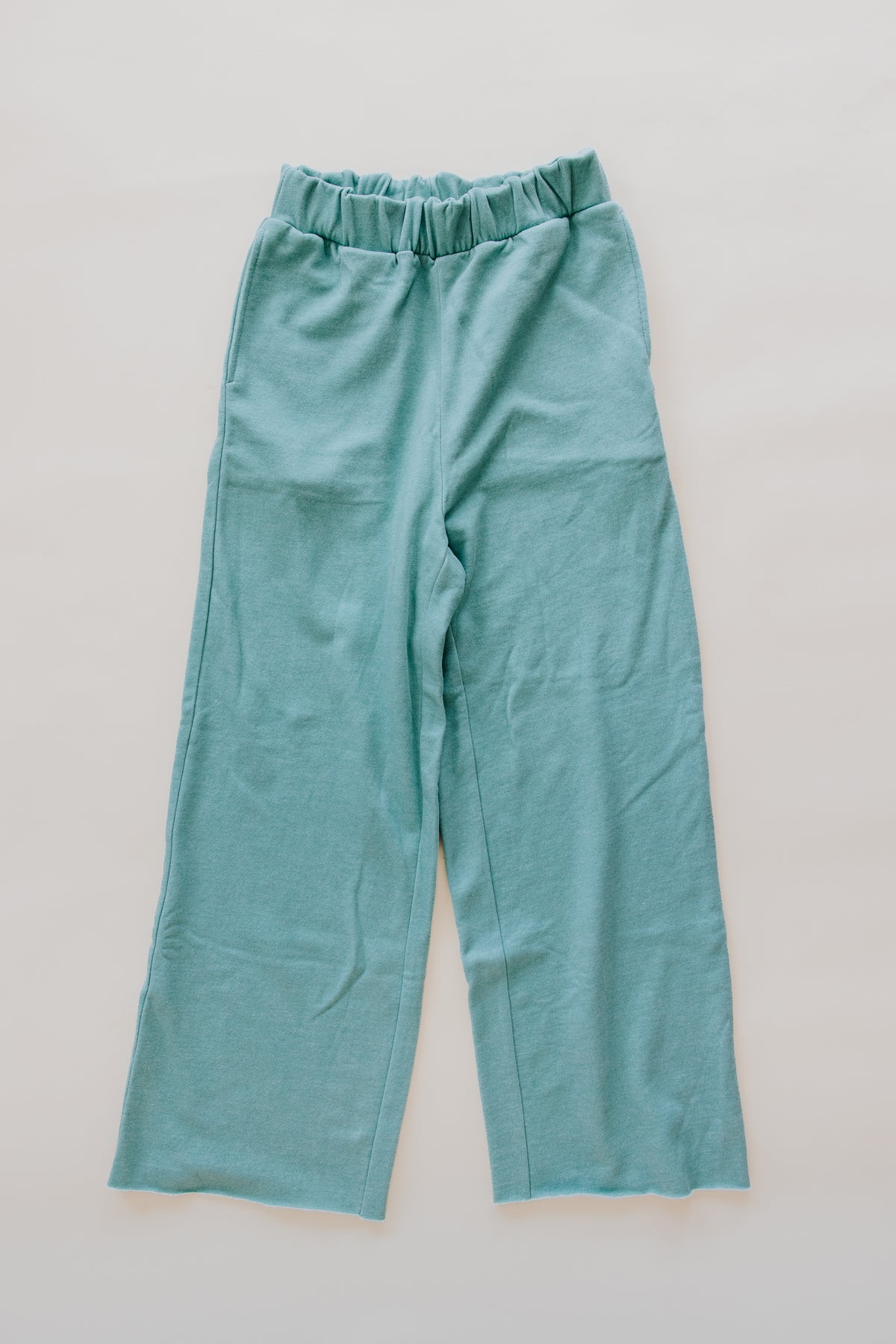 Wings Hawaii french terry Beach Pants in aqua. Cozy cotton stretchy waistband, wide leg, high rise, pockets. Original apparel designed in Maui and made in LA. Maui beach-inspired clothing for coastal living. 