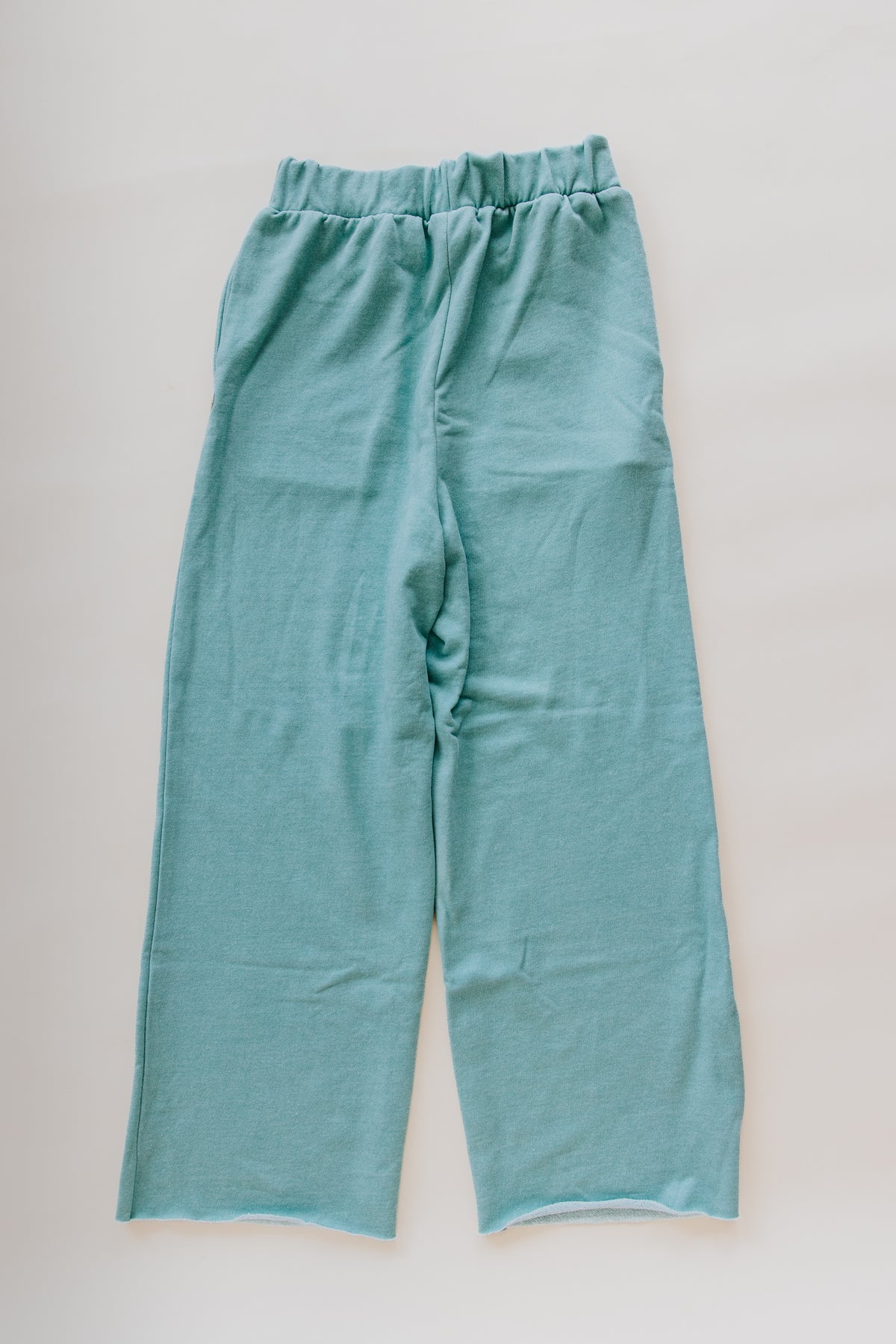 Wings Hawaii french terry Beach Pants in aqua. Cozy cotton stretchy waistband, wide leg, high rise, pockets. Original apparel designed in Maui and made in LA. Maui beach-inspired clothing for coastal living. 