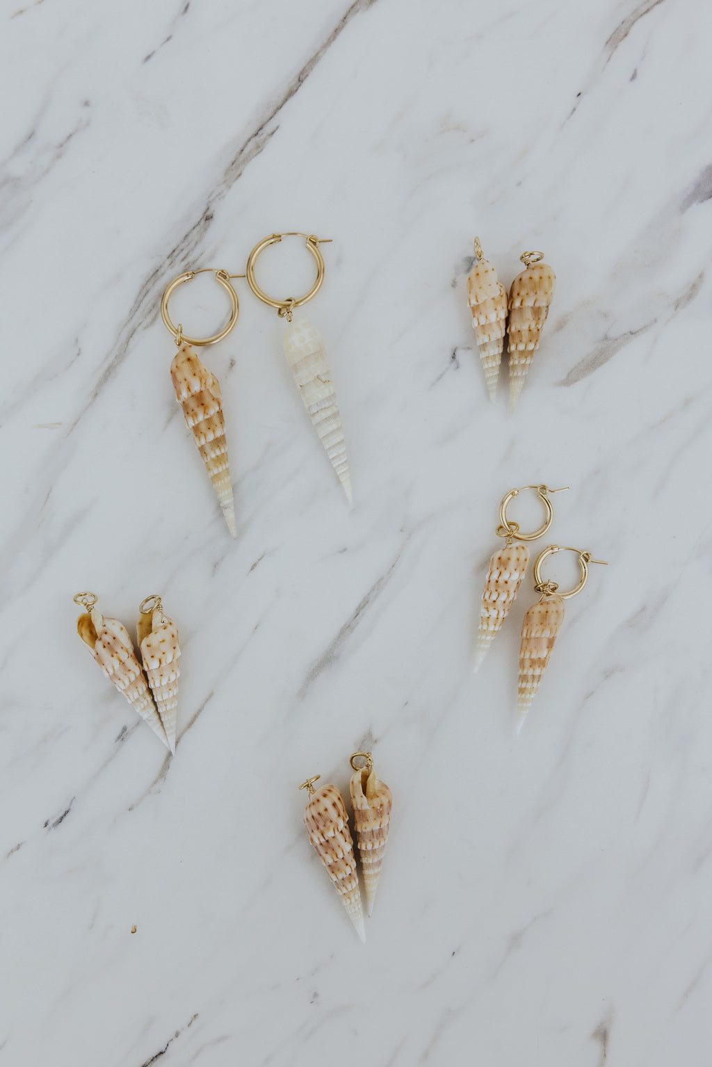 Wings Hawaii Auger Shell charms for hoop earrings. Fine shell jewelry handmade with aloha in Maui. Elevated, modern beach jewelry handcrafted in Hawaii. 