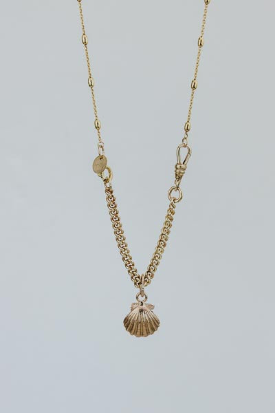 Wings Hawaii Forever Sunrise Shell Necklace Charm in sterling silver, solid 14k yellow gold, or solid 14k rose gold. Fine jewelry handmade in Maui. Shown on necklace and chain extender sold separately. 