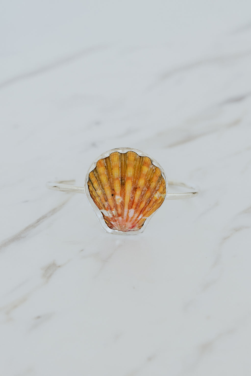 Wings Hawaii Sunrise Shell Cuff. Authentic Hawaiian beach shell on sterling silver bracelet. Fine jewelry handmade with aloha on Maui. One of a kind gifts made in Hawaii. 