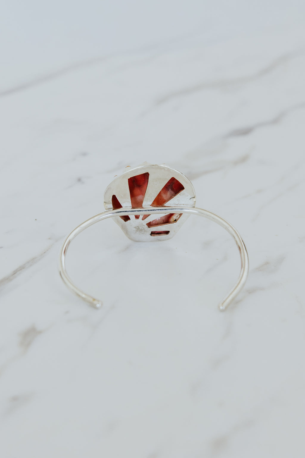 Wings Hawaii Sunrise Shell Cuff. Authentic Hawaiian beach shell on sterling silver bracelet. Fine jewelry handmade with aloha on Maui. One of a kind gifts made in Hawaii. 