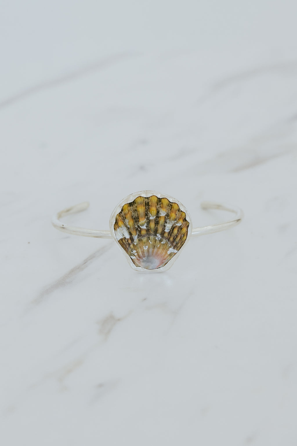 Wings Hawaii Moonrise Shell Cuff. Authentic, rare Hawaiian beach shell on sterling silver bracelet. Fine jewelry handmade with aloha on Maui. One of a kind gifts made in Hawaii. 