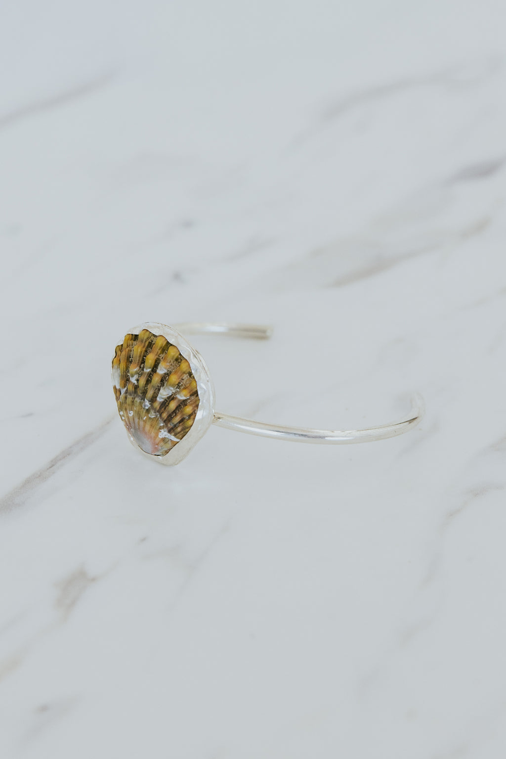 Wings Hawaii Moonrise Shell Cuff. Authentic, rare Hawaiian beach shell on sterling silver bracelet. Fine jewelry handmade with aloha on Maui. One of a kind gifts made in Hawaii. 