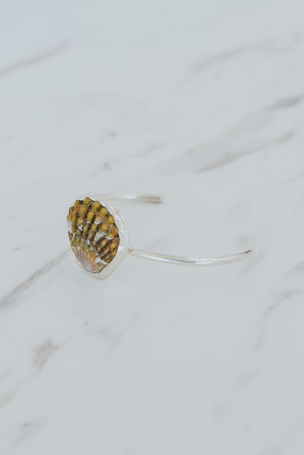 Wings Hawaii Moonrise Shell Cuff. Authentic, rare Hawaiian beach shell on sterling silver bracelet. Fine jewelry handmade with aloha on Maui. One of a kind gifts made in Hawaii. 