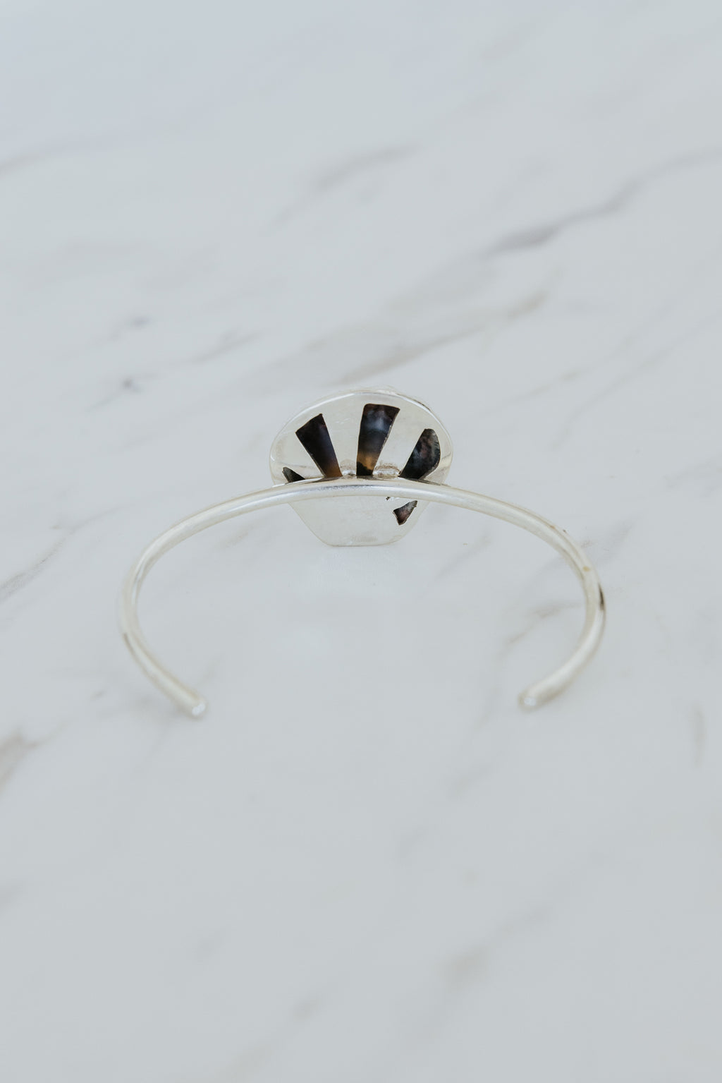 Wings Hawaii Moonrise Shell Cuff. Authentic, rare Hawaiian beach shell on sterling silver bracelet. Fine jewelry handmade with aloha on Maui. One of a kind gifts made in Hawaii. 