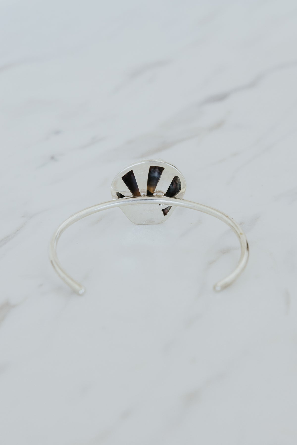 Wings Hawaii Moonrise Shell Cuff. Authentic, rare Hawaiian beach shell on sterling silver bracelet. Fine jewelry handmade with aloha on Maui. One of a kind gifts made in Hawaii. 