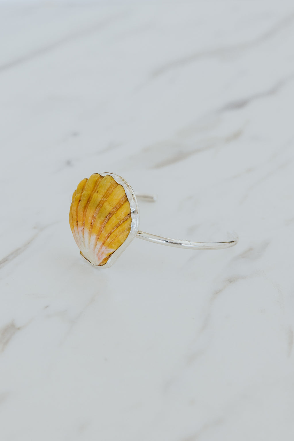 Wings Hawaii Sunrise Shell Cuff. Authentic Hawaiian beach shell on sterling silver bracelet. Fine jewelry handmade with aloha on Maui. One of a kind gifts made in Hawaii. 
