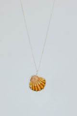Wings Hawaii bezel-set Sunrise Shell necklace. Authentic, rare Hawaiian beach shell on sterling silver chain necklace. Fine jewelry handmade with aloha on Maui. One of a kind gifts made in Hawaii.