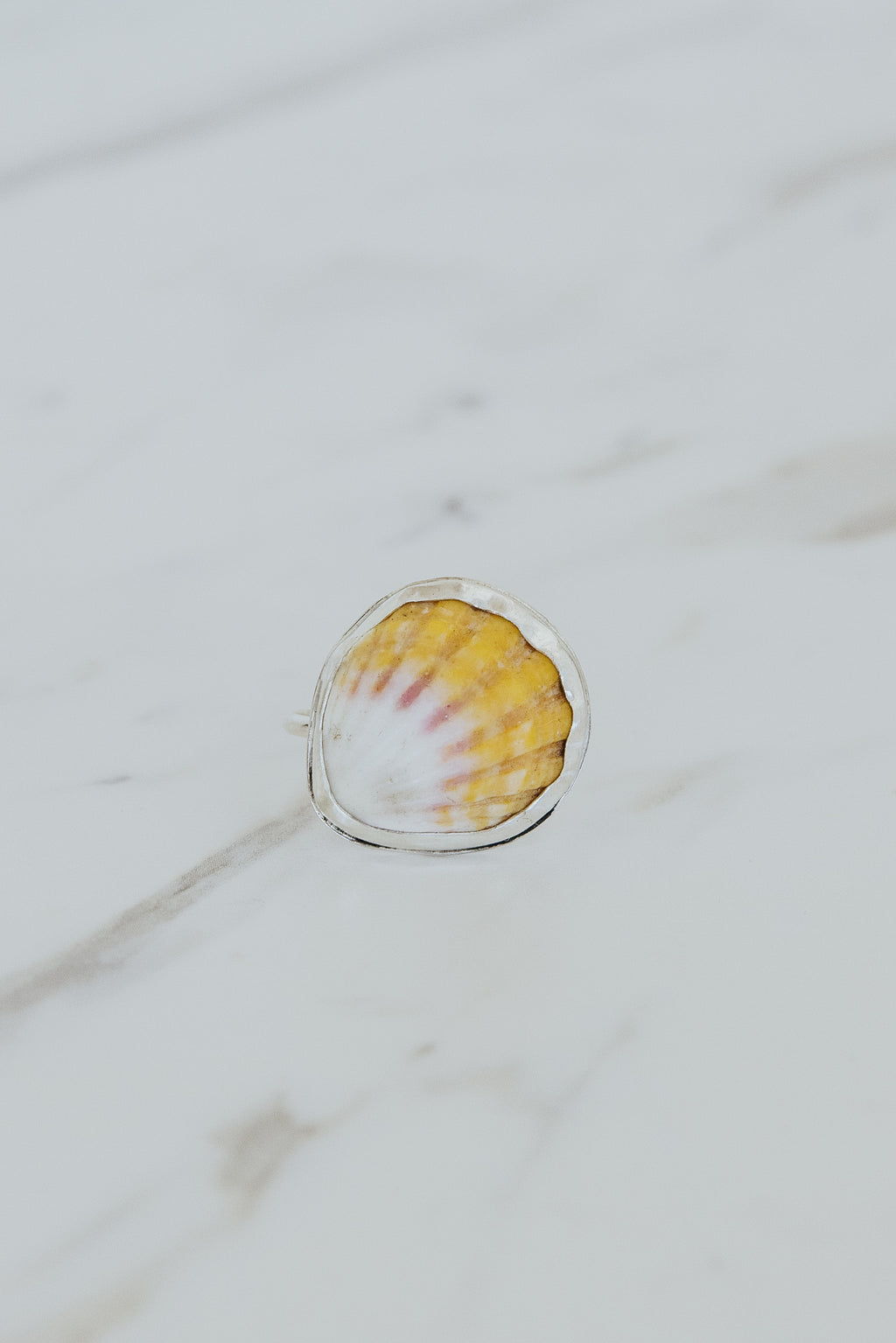 Wings Hawaii bezel-set Sunrise Shell ring bezel-set in sterling silver. Authentic, rare Hawaiian beach shell. Fine jewelry handmade with aloha on Maui. One of a kind gifts made in Hawaii.