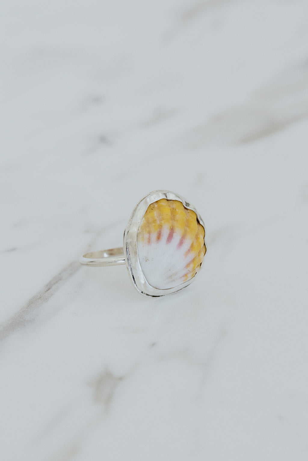Wings Hawaii bezel-set Sunrise Shell ring bezel-set in sterling silver. Authentic, rare Hawaiian beach shell. Fine jewelry handmade with aloha on Maui. One of a kind gifts made in Hawaii.