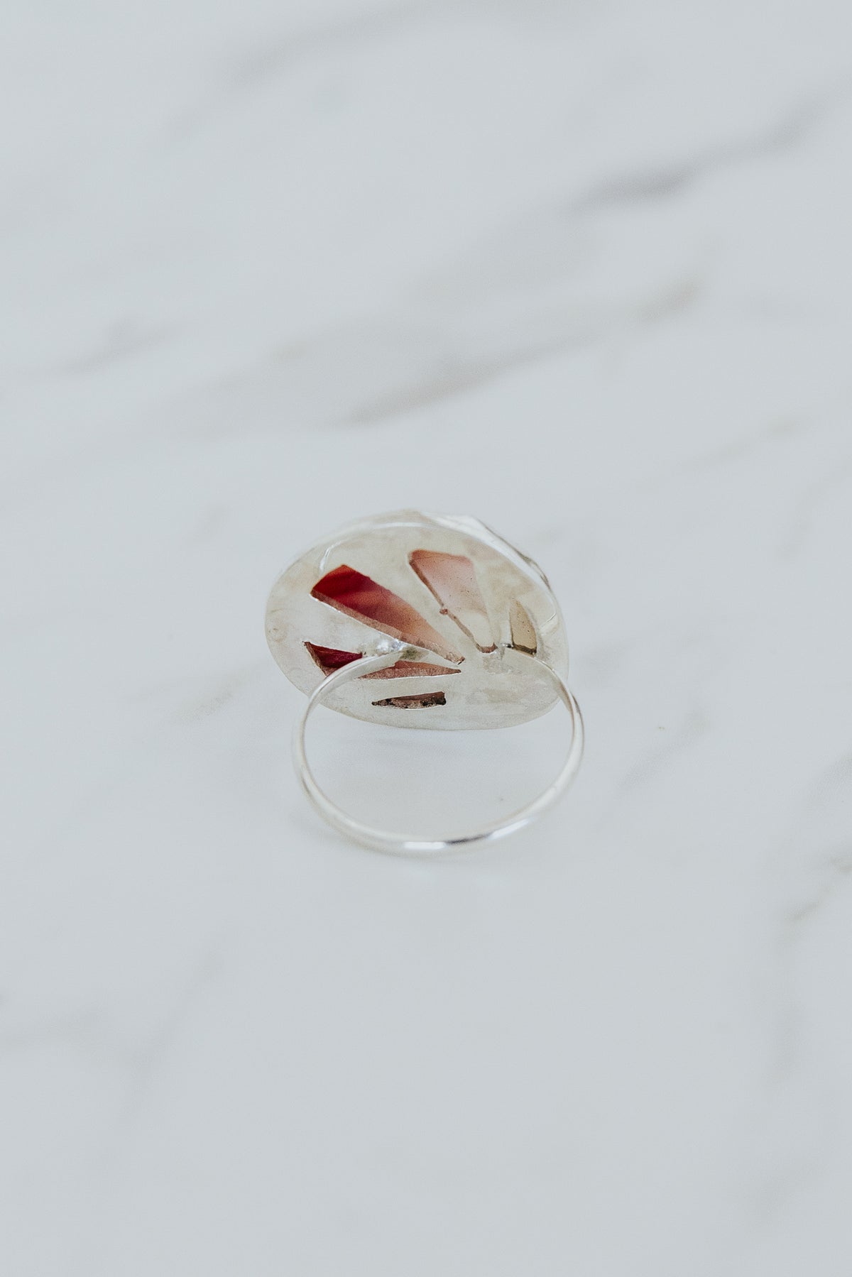 Wings Hawaii bezel-set Sunrise Shell ring bezel-set in sterling silver. Authentic, rare Hawaiian beach shell. Fine jewelry handmade with aloha on Maui. One of a kind gifts made in Hawaii.