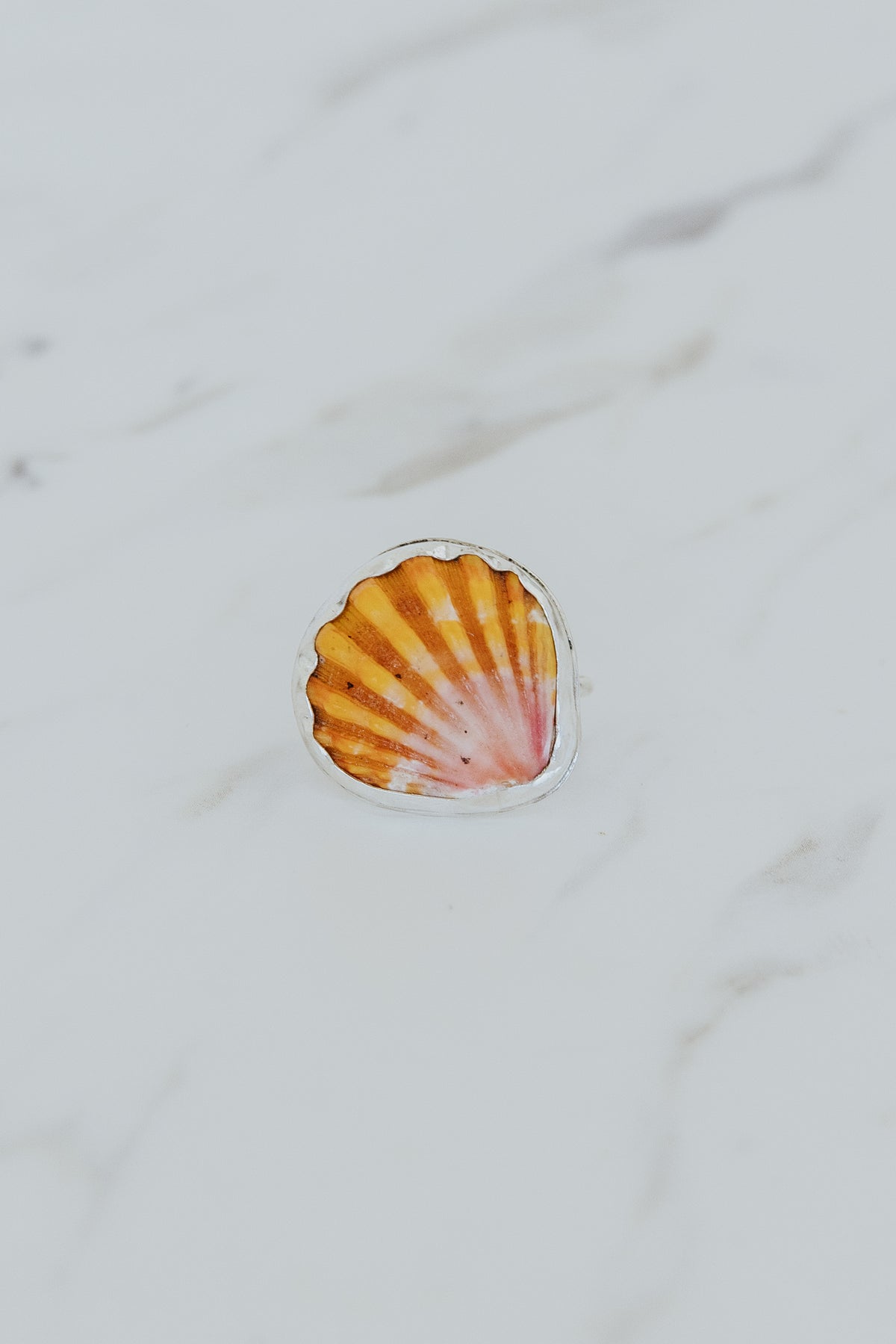 Wings Hawaii bezel-set Sunrise Shell ring bezel-set in sterling silver. Authentic, rare Hawaiian beach shell. Fine jewelry handmade with aloha on Maui. One of a kind gifts made in Hawaii.