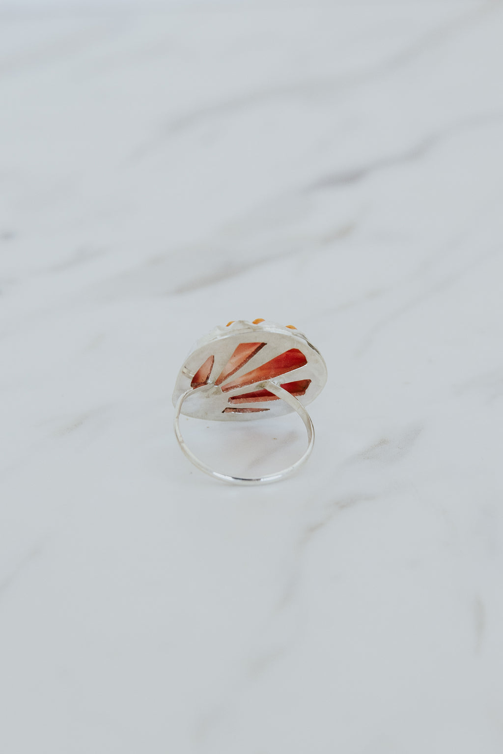 Wings Hawaii bezel-set Sunrise Shell ring bezel-set in sterling silver. Authentic, rare Hawaiian beach shell. Fine jewelry handmade with aloha on Maui. One of a kind gifts made in Hawaii.