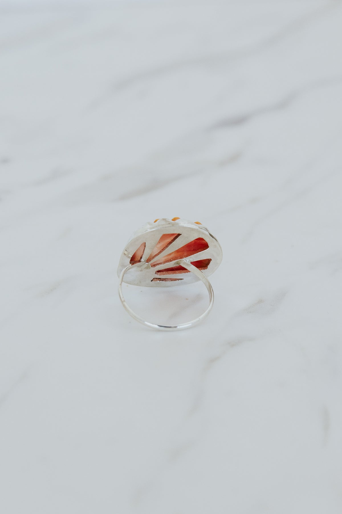 Wings Hawaii bezel-set Sunrise Shell ring bezel-set in sterling silver. Authentic, rare Hawaiian beach shell. Fine jewelry handmade with aloha on Maui. One of a kind gifts made in Hawaii.