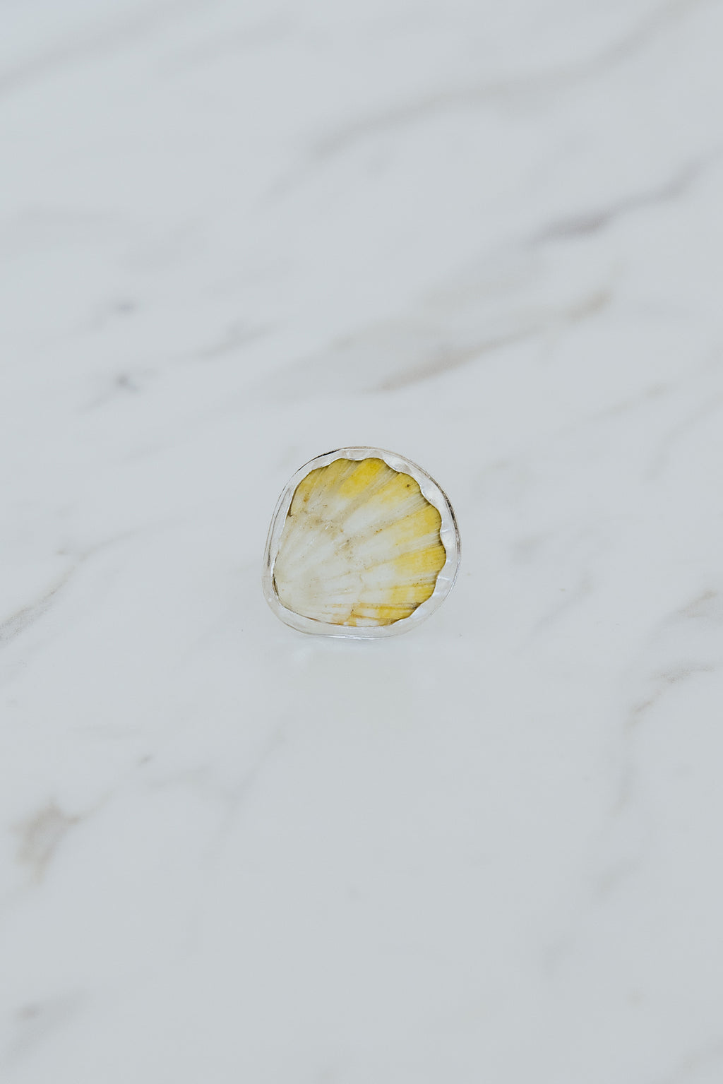 Wings Hawaii bezel-set Sunrise Shell ring bezel-set in sterling silver. Authentic, rare Hawaiian beach shell. Fine jewelry handmade with aloha on Maui. One of a kind gifts made in Hawaii.
