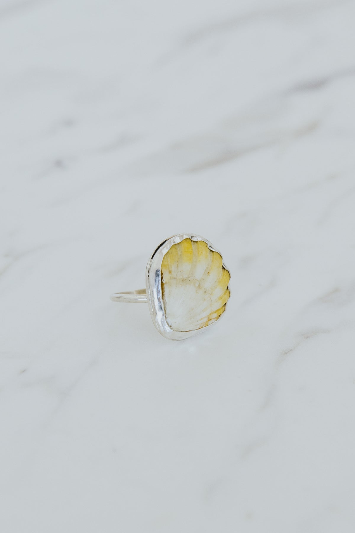 Wings Hawaii bezel-set Sunrise Shell ring bezel-set in sterling silver. Authentic, rare Hawaiian beach shell. Fine jewelry handmade with aloha on Maui. One of a kind gifts made in Hawaii.