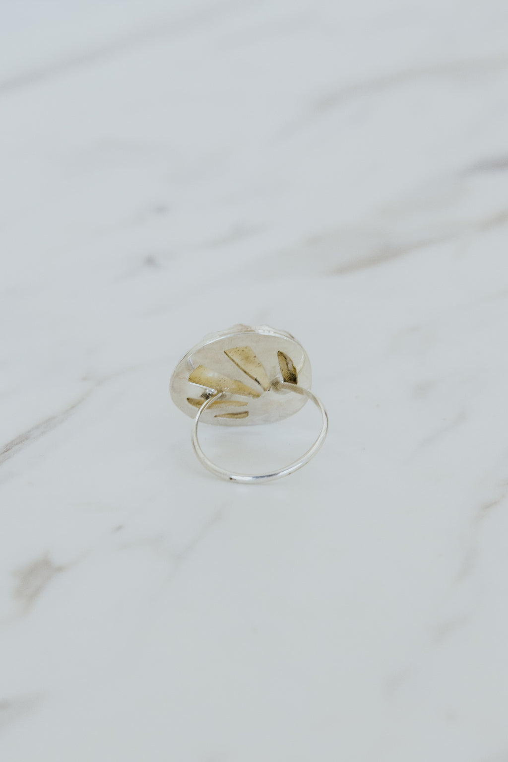 Wings Hawaii bezel-set Sunrise Shell ring bezel-set in sterling silver. Authentic, rare Hawaiian beach shell. Fine jewelry handmade with aloha on Maui. One of a kind gifts made in Hawaii.