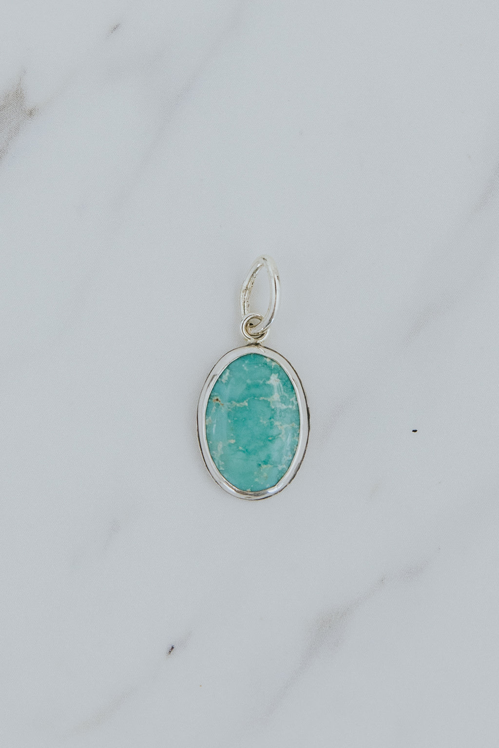 Wings Hawaii bezel-set Arizona Turquoise necklace charm in sterling silver. Fine jewelry and modern charm necklaces handmade in Maui. 