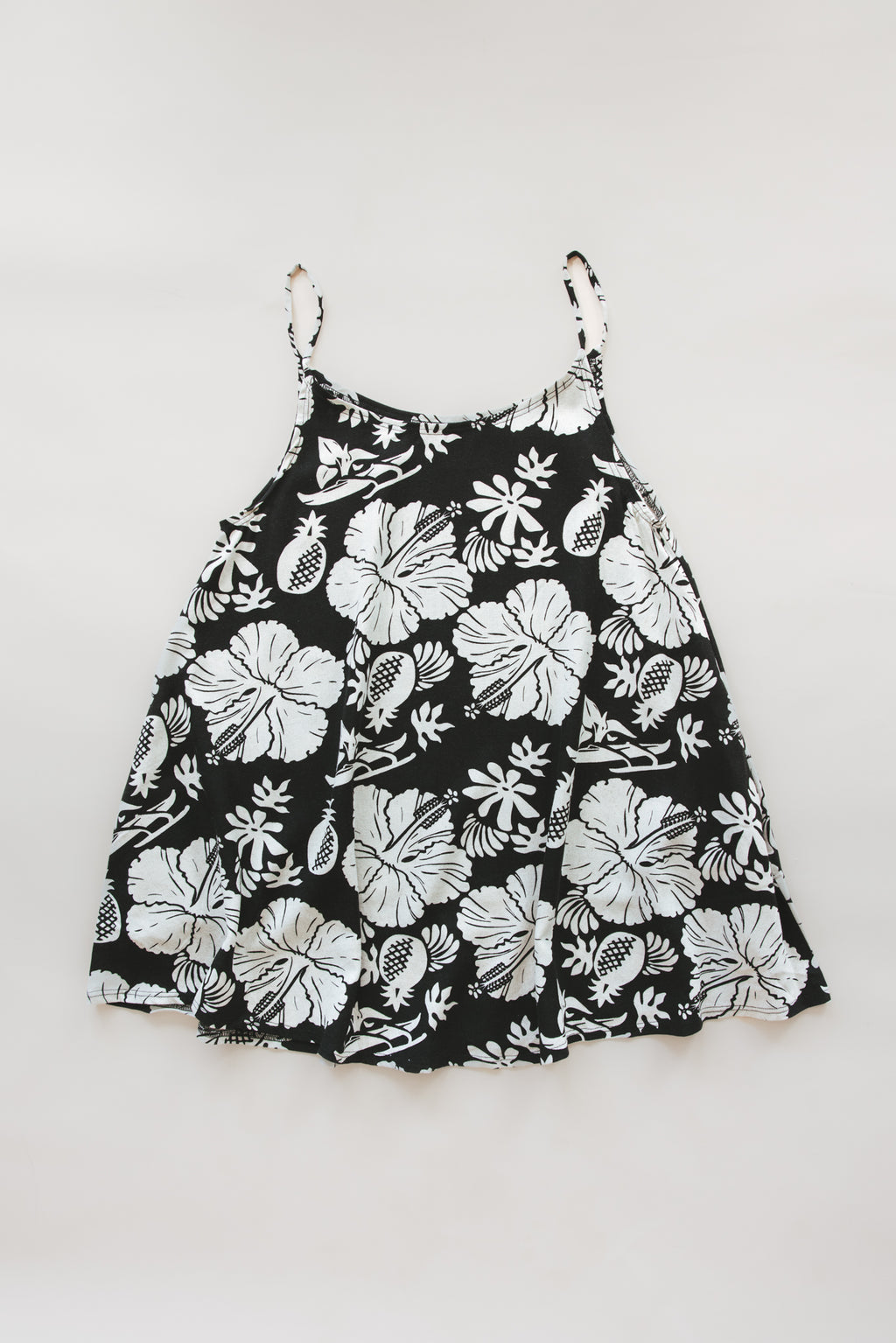 Wings Hawaii trapeze mini dress in Hana Nightfall black and beige aloha print. Designed in Maui, made in Bali. Small batch, sustainable, slow fashion. 