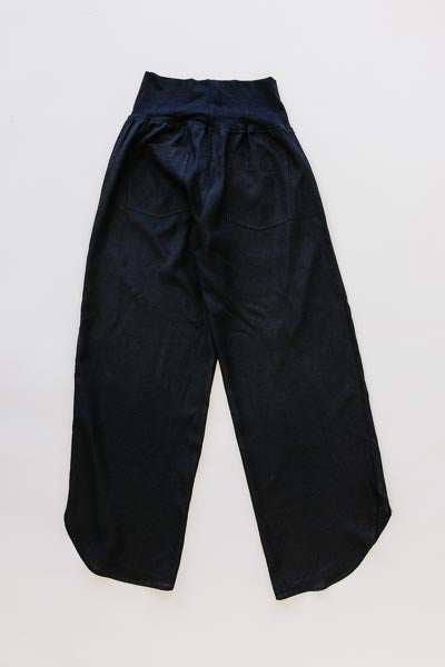 Wings Hawaii best-selling women's Pau Hana pants in classic black. Soft, stretchy waistband and scalloped hem. Small batch, sustainable clothing designed in Maui, sewn in Bali. 