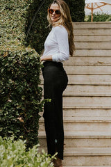 Wings Hawaii model wearing Pau Hana pants in classic black thumbnail